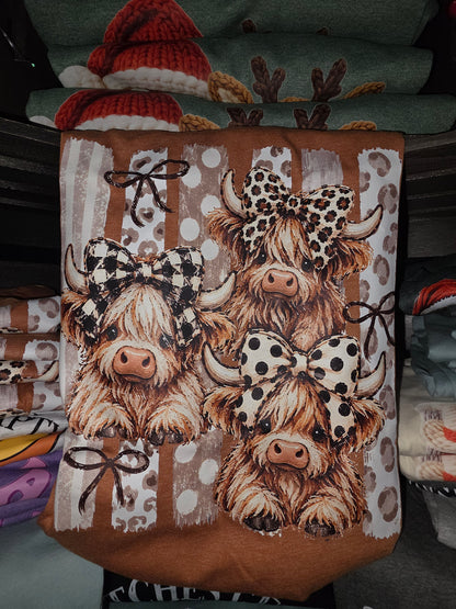 multiple Highland cows